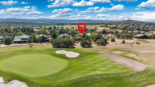 birds eye view of property with a mountain view, a residential view, and view of golf course