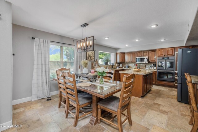 9708 E Pampa Ave, Mesa, AZ 85212 - dining space with stone tile flooring, baseboards, a chandelier, and recessed lighting