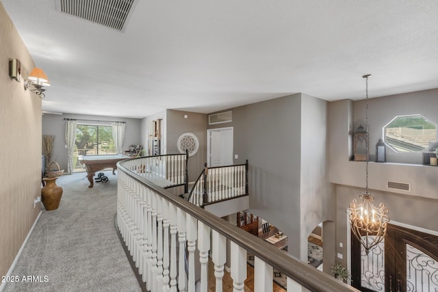9708 E Pampa Ave, Mesa, AZ 85212 - corridor with an upstairs landing, baseboards, a chandelier, and carpet