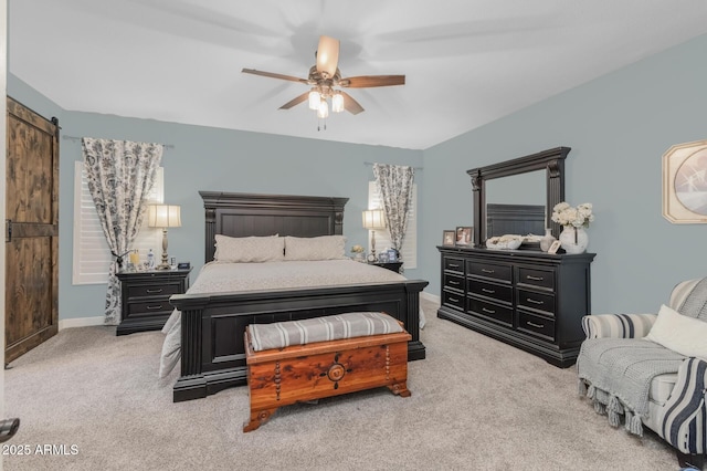 9708 E Pampa Ave, Mesa, AZ 85212 - bedroom featuring carpet, a barn door, baseboards, and ceiling fan