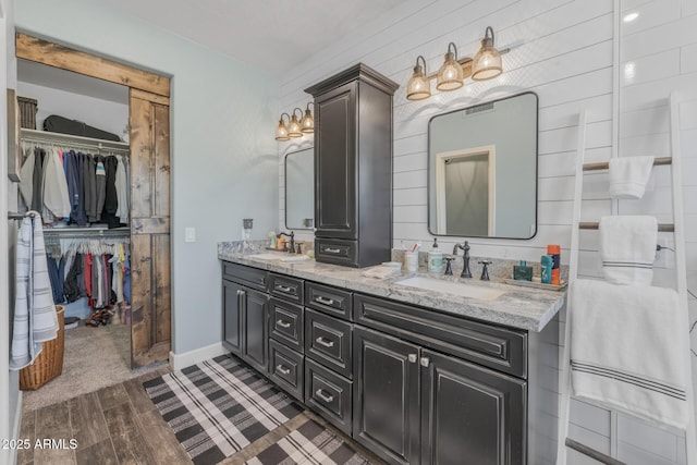 9708 E Pampa Ave, Mesa, AZ 85212 - full bath featuring double vanity, a walk in closet, and wood finished floors