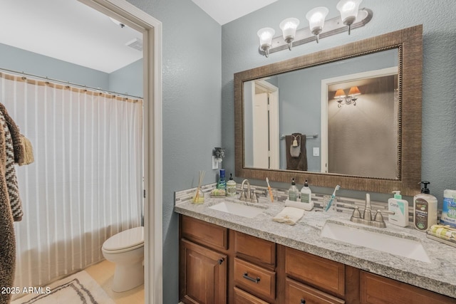 9708 E Pampa Ave, Mesa, AZ 85212 - full bath with a textured wall, toilet, double vanity, and a shower with shower curtain