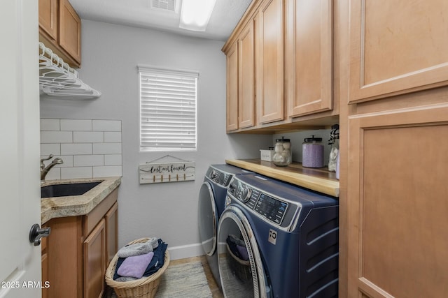 9708 E Pampa Ave, Mesa, AZ 85212 - clothes washing area featuring washer and clothes dryer, cabinet space, and baseboards