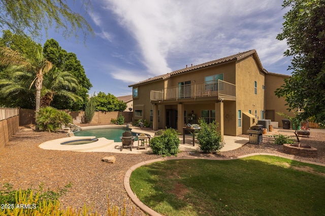 9708 E Pampa Ave, Mesa, AZ 85212 - back of property with a balcony, a patio, stucco siding, and an in-ground hot tub