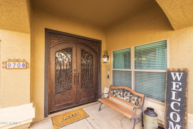 9708 E Pampa Ave, Mesa, AZ 85212 - doorway to property with stucco siding