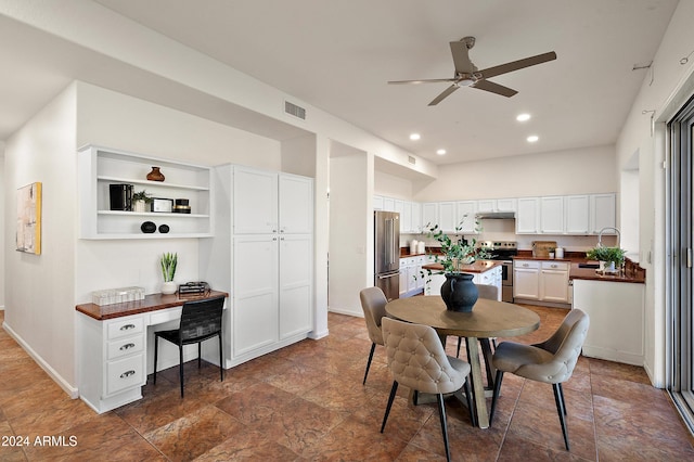 dining space featuring ceiling fan and sink