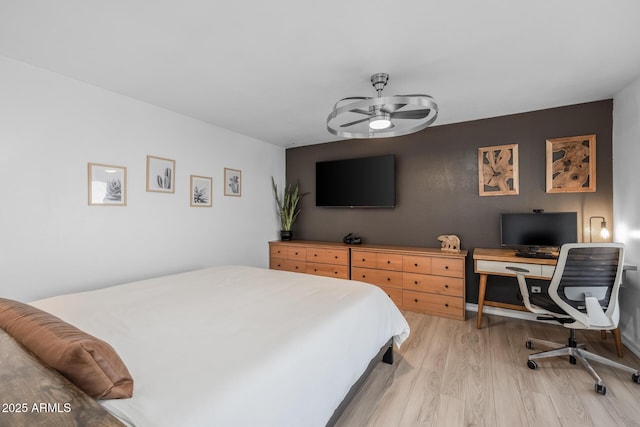 bedroom featuring light wood-style flooring
