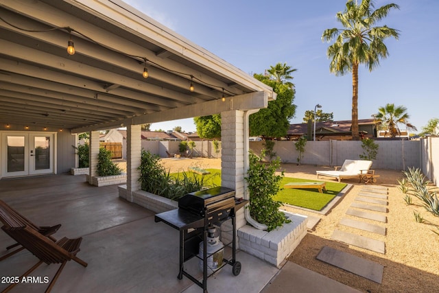 view of patio / terrace featuring french doors and a fenced backyard
