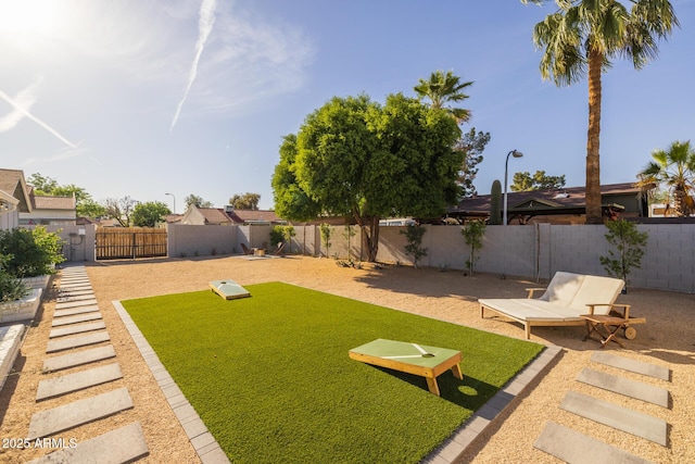 view of yard with a fenced backyard