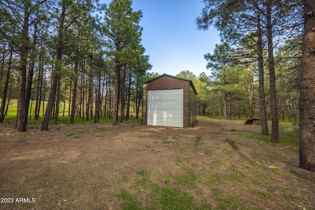 1053 Pond Cir, Forest Lakes, AZ 85931 - exterior space featuring a garage, an outdoor structure, and dirt driveway