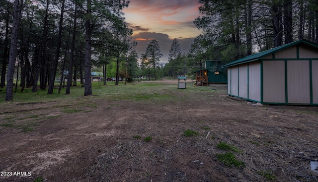 1053 Pond Cir, Forest Lakes, AZ 85931 - yard at dusk featuring an outbuilding