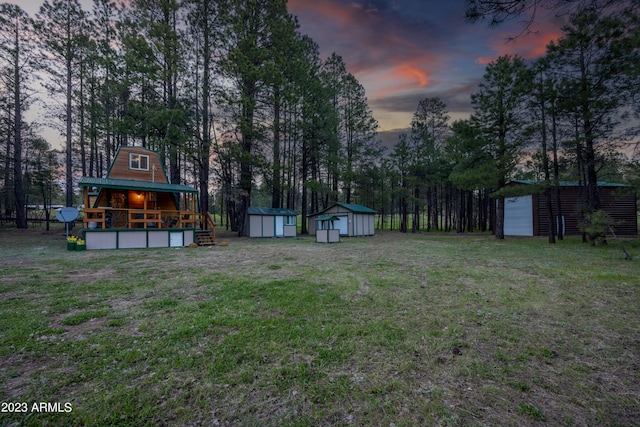 1053 Pond Cir, Forest Lakes, AZ 85931 - yard at dusk featuring an outdoor structure and a shed