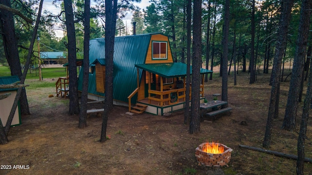 1053 Pond Cir, Forest Lakes, AZ 85931 - view of playground with a fire pit and an outbuilding