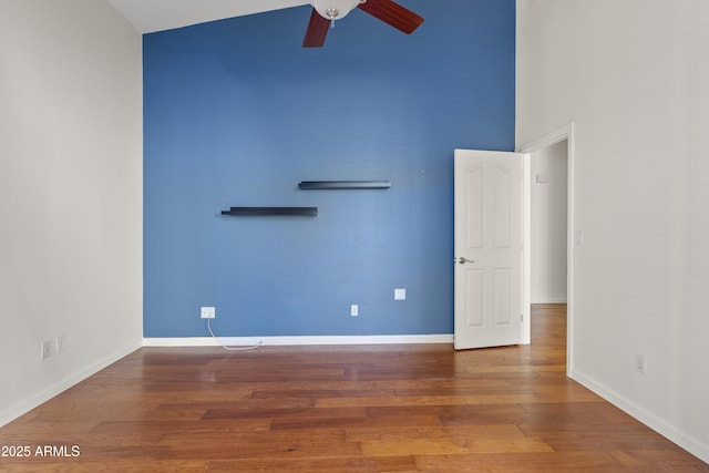 unfurnished room featuring hardwood / wood-style floors and ceiling fan