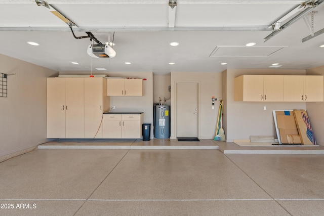 garage with a garage door opener and electric water heater