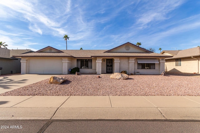 ranch-style home featuring a garage