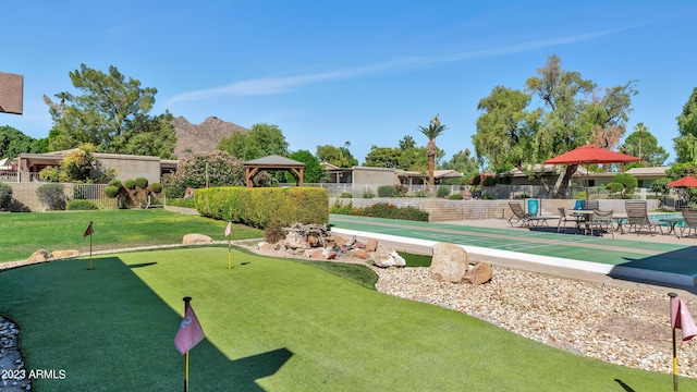 view of property's community featuring a gazebo and a patio area