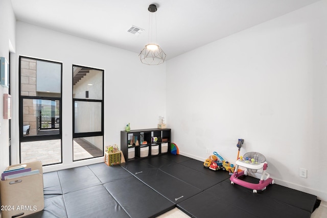interior space with baseboards and visible vents