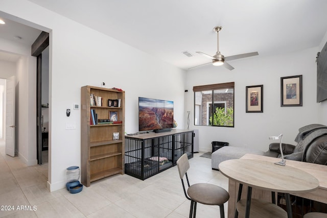 dining room featuring a ceiling fan, baseboards, visible vents, and light tile patterned floors