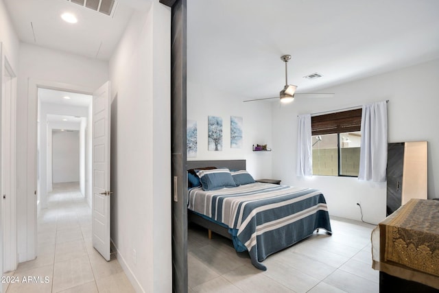 bedroom with light tile patterned floors and ceiling fan