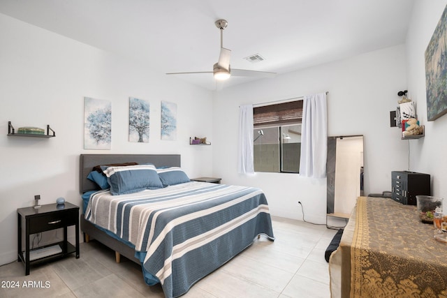 bedroom featuring light tile patterned floors and ceiling fan