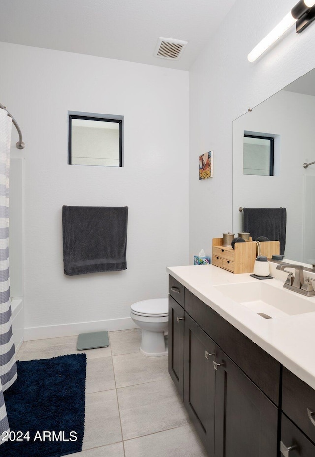full bath with tile patterned flooring, visible vents, vanity, toilet, and baseboards