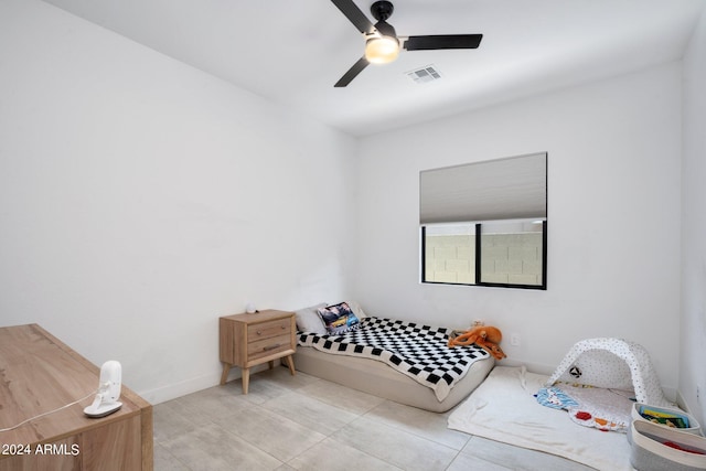 bedroom featuring visible vents, a ceiling fan, and tile patterned flooring