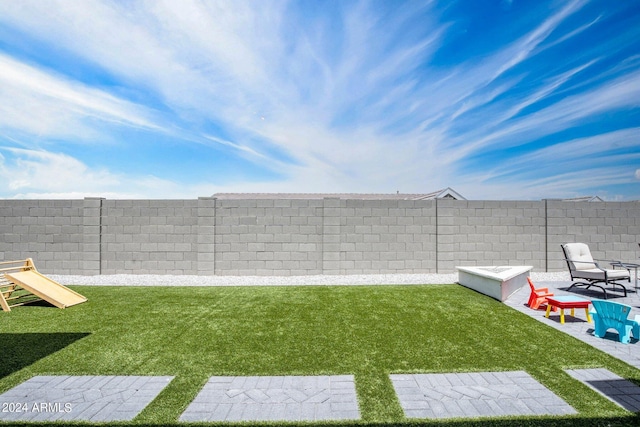 view of yard with a fenced backyard