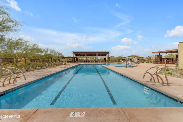 view of swimming pool with a patio