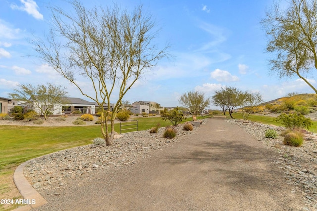 view of property's community featuring a lawn