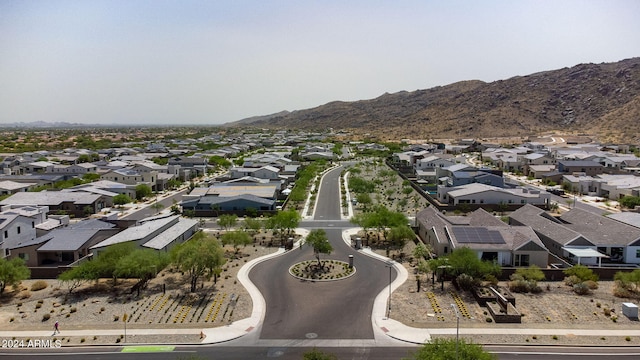 birds eye view of property with a mountain view and a residential view