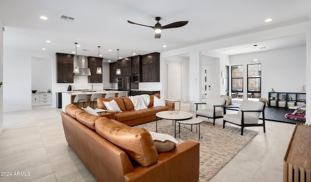 tiled living room featuring ceiling fan