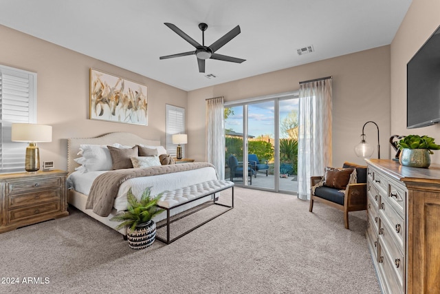 bedroom featuring access to outside, light carpet, and ceiling fan