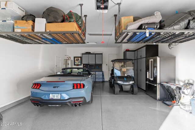 garage with water heater and high end refrigerator