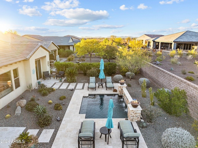 view of swimming pool with a patio area