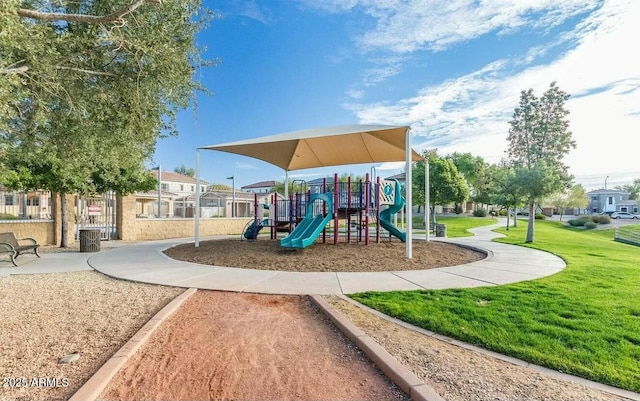 community playground featuring central AC unit and a lawn