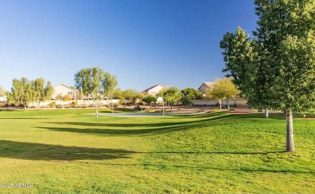 view of property's community featuring a lawn