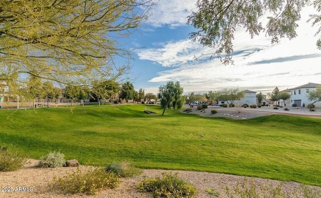 surrounding community featuring a residential view and a lawn