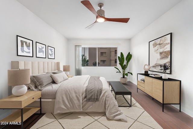 bedroom with hardwood / wood-style floors and ceiling fan