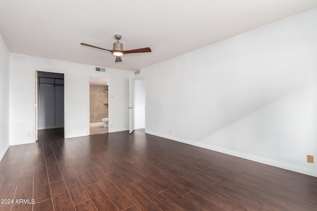 unfurnished room with ceiling fan and dark hardwood / wood-style flooring