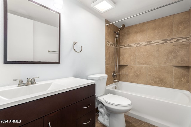 full bathroom with tiled shower / bath combo, vanity, and toilet