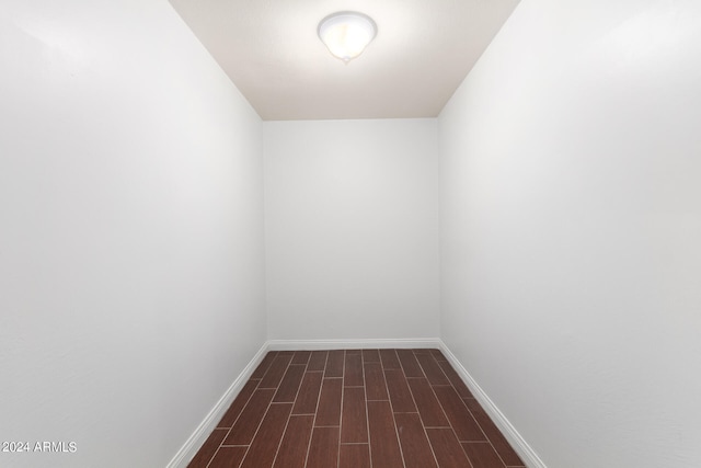 empty room featuring dark wood-type flooring