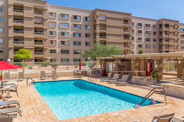 view of swimming pool featuring a patio