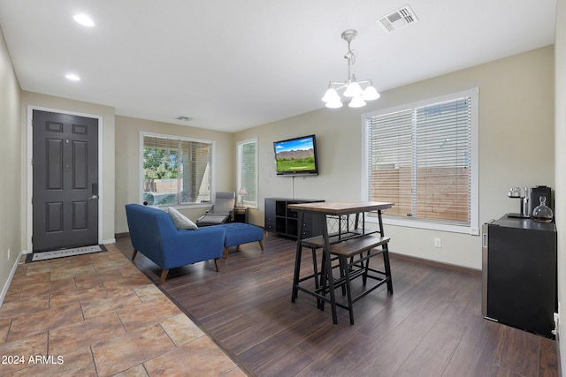 dining room featuring an inviting chandelier and hardwood / wood-style floors