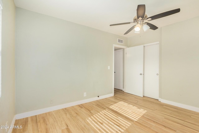 unfurnished bedroom with ceiling fan and light hardwood / wood-style floors