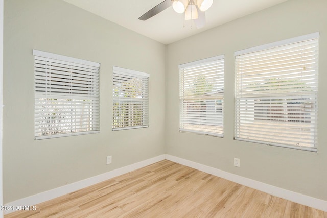 unfurnished room with ceiling fan and wood-type flooring