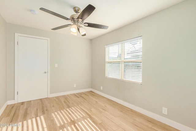 spare room featuring ceiling fan and light hardwood / wood-style flooring