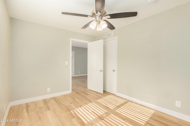 spare room featuring ceiling fan and light hardwood / wood-style floors