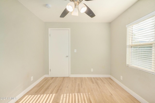 spare room with ceiling fan and light hardwood / wood-style flooring