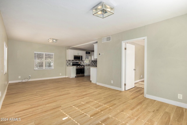 unfurnished living room featuring light hardwood / wood-style flooring